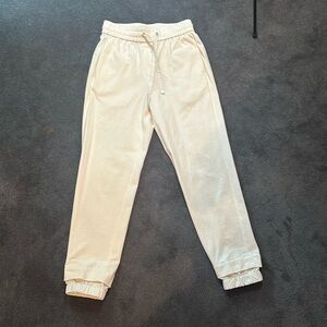 Women’s cream jogger pants with fitted nylon ankle